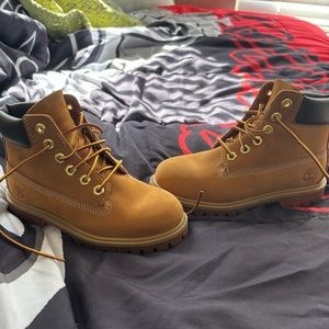 Timberland boots..boys size 12..worn once…not hurt